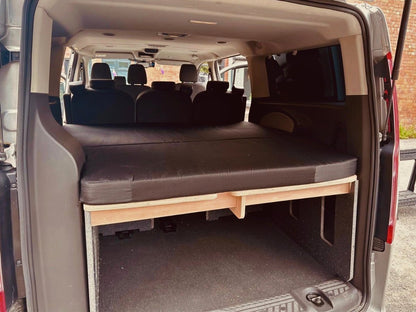 Ford Torneo Custom with Orbvans campervan conversion kit installed with mattress.